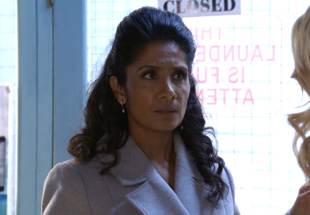 Suki looking concerned in the launderette in EastEnders