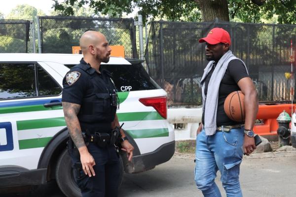NYPD Central Park Precinct police speaking to the victim of a gunpoint robbery inside the park.