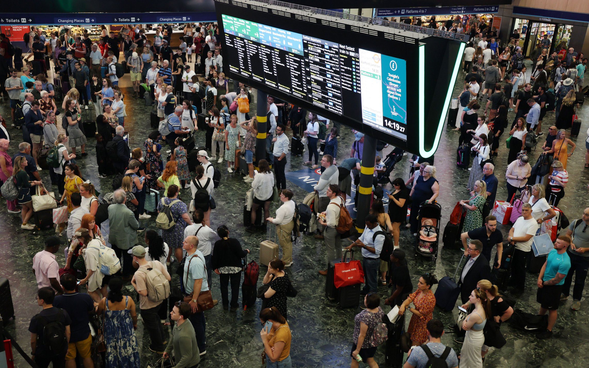 Mandatory Credit: Photo by ANDY RAIN/EPA-EFE/Shutterstock (14594403k) Commuters at Euston Station in London, Britain, 19 July 2024. Companies and institutions around the world, including rail operators and airlines, have been affected on 19 July by a major computer outage in systems running Microsoft Windows linked to a faulty CrowdStrike cyber-security software update. According to CrowdStrike's CEO, the issue has been identified, isolated and a fix has been deployed. Mass IT outage hits companies and infrastructure around thw world, London, United Kingdom - 19 Jul 2024