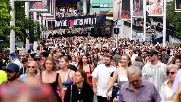 Fans gather outside Wembley Stadium ahead of Taylor Swift's latest Eras Tour concert.
Pic: PA